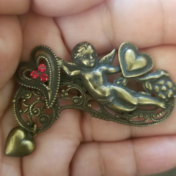 Vintage Victorian Filigree Cupid Brooch With Red Rhinestones  Vintage Victorian Filigree Cupid Brooch with Red Rhinestones